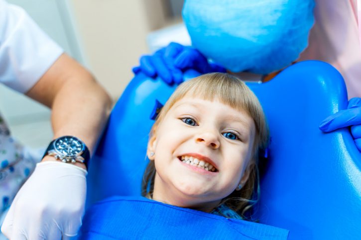 Cute girl in dental clinic