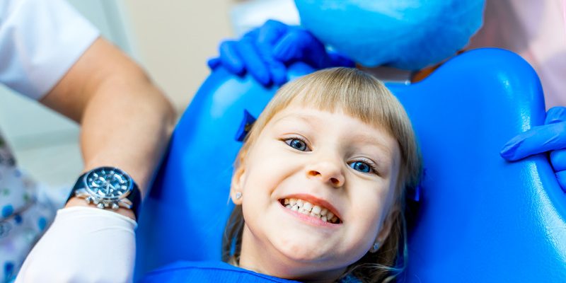 Cute girl in dental clinic
