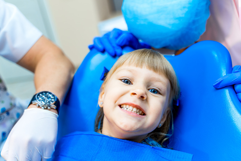 Cute girl in dental clinic